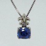 Cusion Cut Sapphire Pendant with Fleur De Lis Bail and Princess Cut Diamond - Dyke Vandenburgh Jewelers