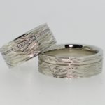 Ladies Diamond and Gents Engraved Wave Pattern Wedding Bands - Dyke Vandenburgh Jewelers