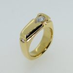 Upside Down Pear Shape and Round Flush Set Diamond Ring - Dyke Vandenburgh Jewelers